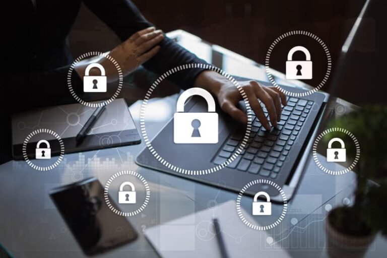 Hands typing on a laptop with padlock icons for cybersecurity
